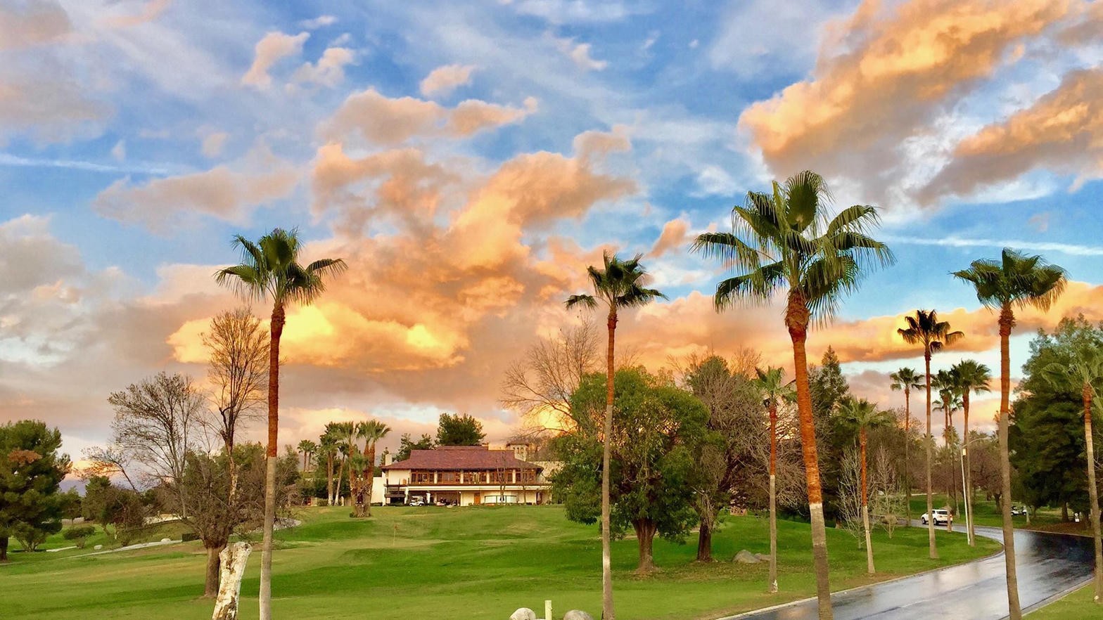 Sunset over palms and the Rio Bravo clubhouse